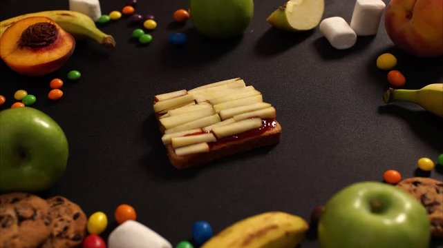 CLOSE UP FOOD: sweet sandwich with fruits and nutella on a black background 