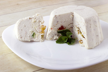 Curd cheese pudding with walnuts, raising and dried fruits