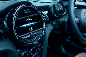 Voice recognition , speech talk and internet of things (iots) in smart car concept. Car 's console show application display and sound wave.
