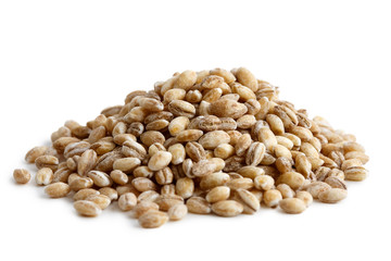 Heap of pearl barley isolated on white.