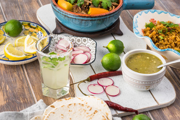 Mexican food. Slow cooked pork carnitas with salsa verde