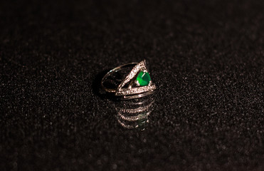 silver ring with a green stone