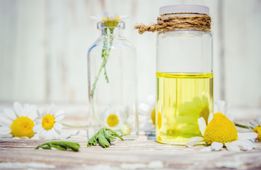 A chamomile tincture in a small bottle. Selective focus. 
