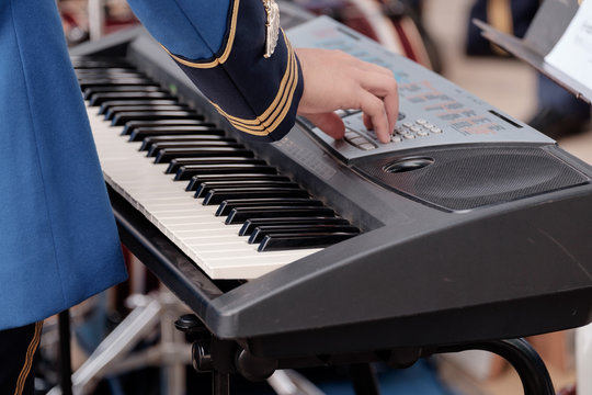Electone keyboard / View of military hand adjust electone keyboard.