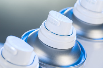 Aerosol spray cans nozzle closeup. Spray cans with shallow depth of field. Air freshener product...