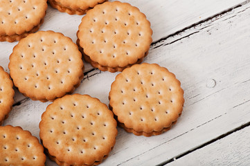 Tasty baked cookies on old wooden background.