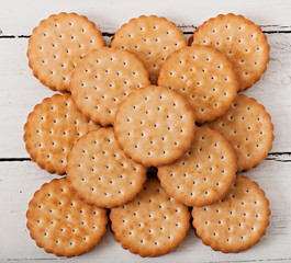 Tasty baked cookies on old wooden background, top view.