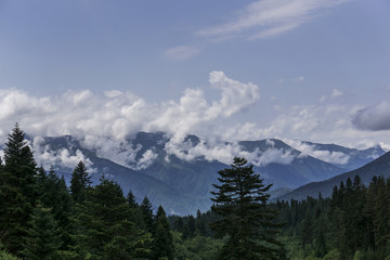 Naklejka na ściany i meble Mountains and clouds from georgia