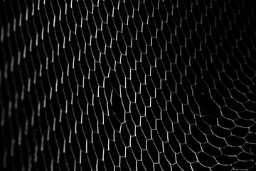 soccer ball in goal net isolated on black background
 - obrazy, fototapety, plakaty