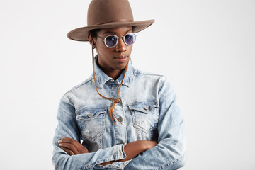 cowboy style black woman in blue colored glasses