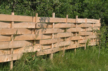 The unique, economical and simple protective fence from wooden waste lining. You can use it where the apiary