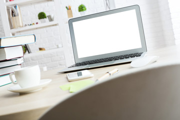 Office desk with white laptop