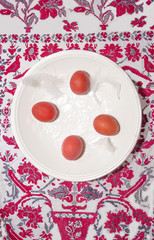 table decoration on white wooden background with quail eggs