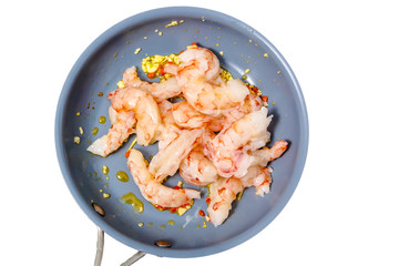 Prawns, garlic and chilli fried in olive oil in a skillet. Insul