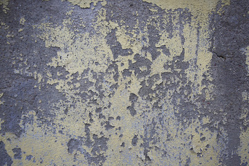 The surface of the wall with peeling paint
