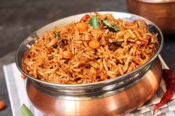 Puliyogare / Tamarind Rice - Tangy and spicy South Indian rice, selective focus