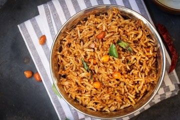 Puliyogare / Tamarind Rice - Tangy and spicy South Indian rice, selective focus