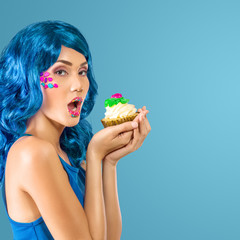 Young woman with cupcake