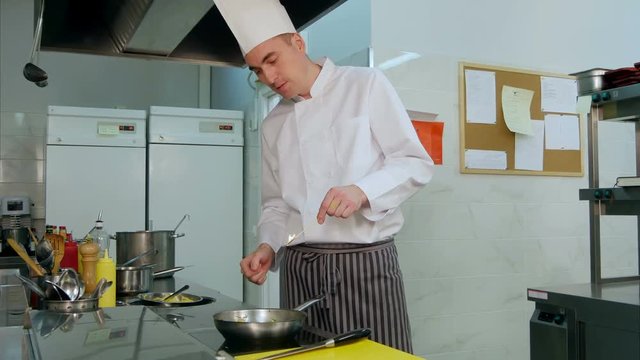 Chef doing flambe with vegetables