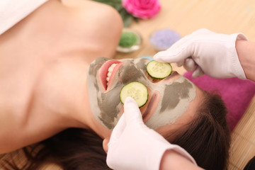 Spa. Care Facial. Face Treatment. Woman in Beauty Salon Gets Marine Mask.