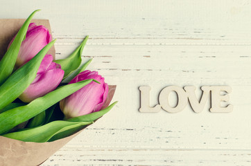 Tulip flowers with wooden word LOVE
