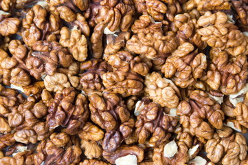 Peeled walnuts background texture