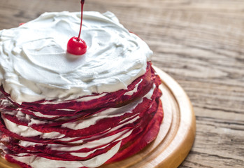 Red velvet crepe cake on the wooden board