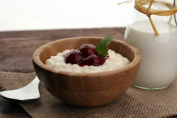 Milk rice pudding with hot cherries