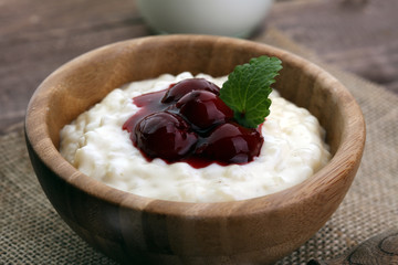 Milk rice pudding with hot cherries