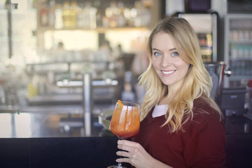 Blonde drinking in bar