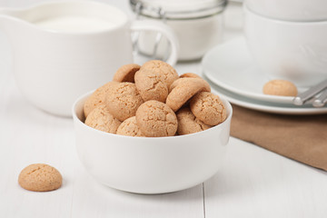 Amaretti Biscuits. Kitchenware. White Wooden Table