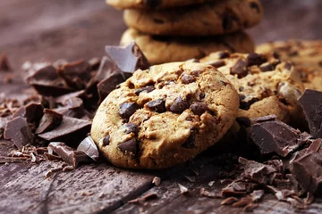 Gordijnen Chocolate cookies on wooden table. Chocolate chip cookies shot © beats_