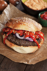 Pljeskavica, serbian burger with roasted peppers