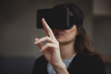 Business executive using virtual reality headset