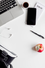 virtual reality glasses on mans working desktop top view