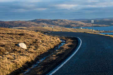 Curvy road on the coast of Shetland Islands