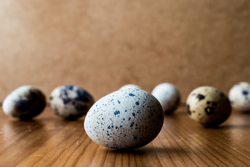 Quail Eggs on wooden surface.