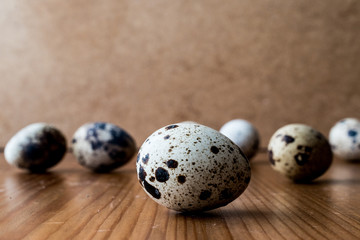 Quail Eggs on wooden surface.