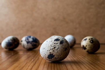 Quail Eggs on wooden surface.