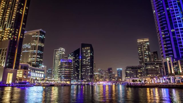 Popular district of Dubai Marina at night.  Time lapse. Dubai, UAE.