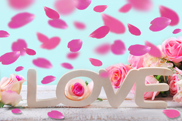 romantic love background with falling rose petals