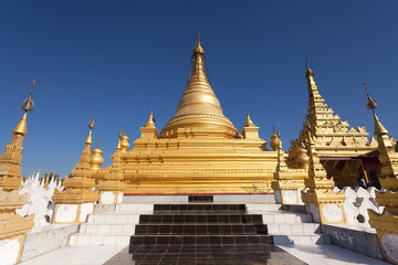 Fototapeta premium Stairs leading to a Gold Pagoda in Mandalay Burma 
