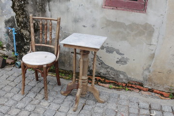 chair and table  ancient at The background is the old wall