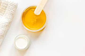 concept depilation with wax on white background top view