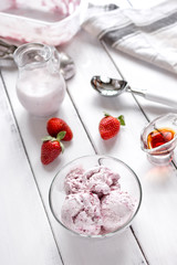 organic homemade ice cream in glass bowl on wooden background