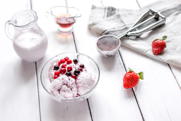 organic homemade ice cream in glass bowl on wooden background
