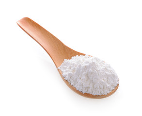 Fototapeta na wymiar Pile of white wheat flour in wooden spoon