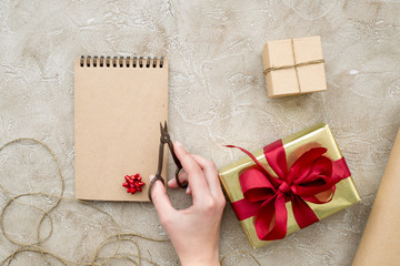 wrapping gifts in box for holiday top view mock up
