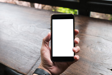 Business man holding smart phone with white screen background for innovative; smart life; IT; social media; online concept design.