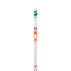 New orange toothbrush. Studio shot isolated on white